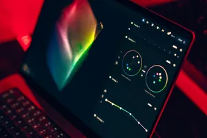 A close-up shot of a laptop displaying a color grading dashboard with vibrant colors. jigsaw puzzle