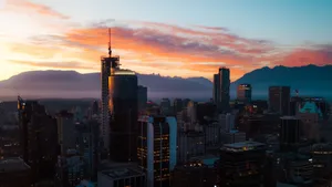 Stunning Vancouver cityscape with glowing sunset and mountain backdrop, showcasing modern architecture. jigsaw puzzle