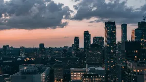 A breathtaking aerial view of Toronto's skyline at dusk showcasing skyscrapers and city lights. jigsaw puzzle