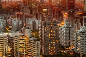 Stunning view of a cityscape illuminated at twilight, showcasing modern architecture and vibrant city life. jigsaw puzzle