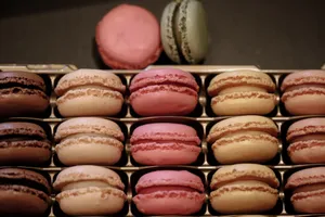 Assorted colorful macarons displayed in a box, highlighting their various flavors and hues. jigsaw puzzle