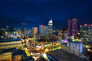 Dazzling evening cityscape featuring colorful high rises and luminous city lights. jigsaw puzzle
